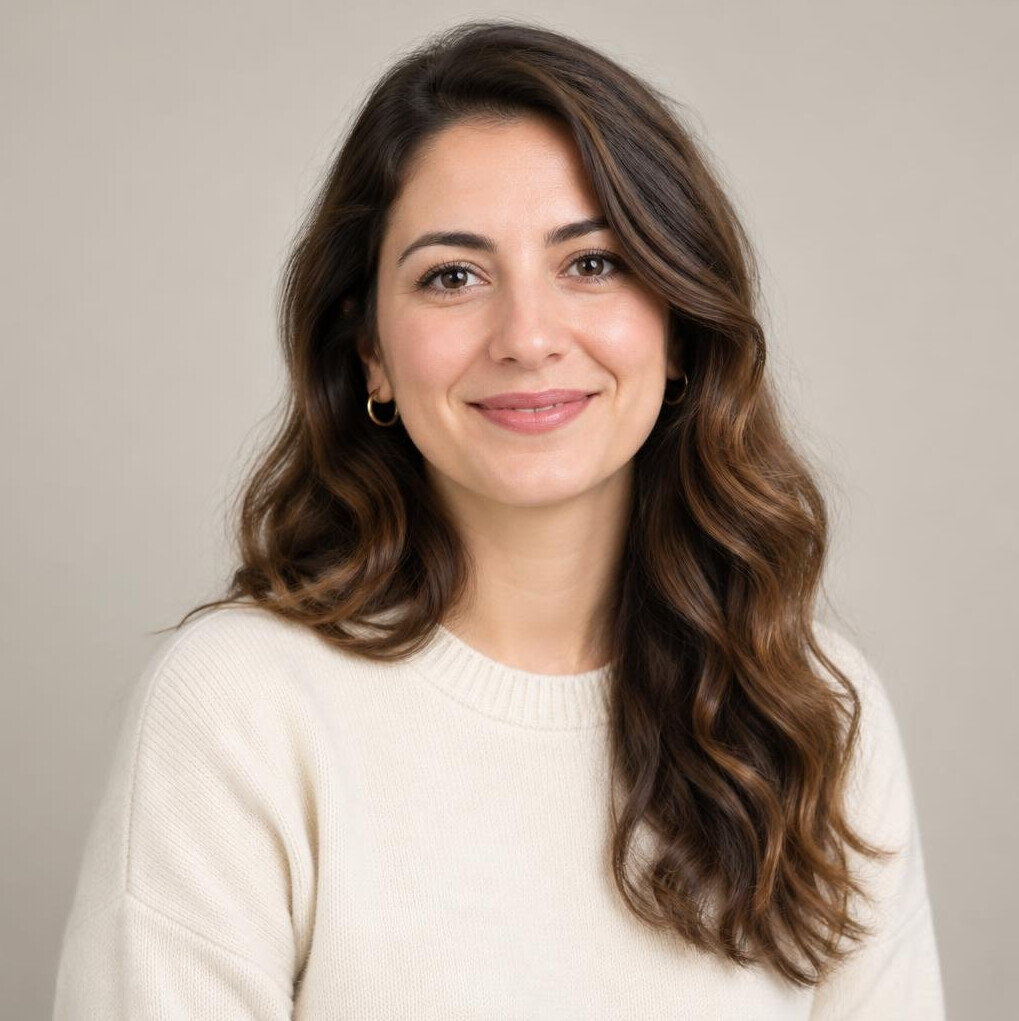 Portrait of a woman with wavy hair smiling